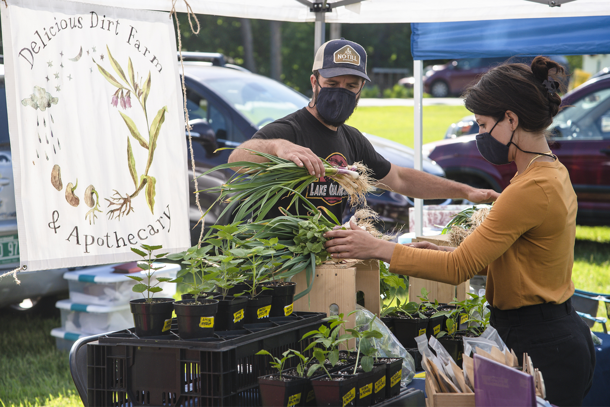 A person shopping at an outdoor market.