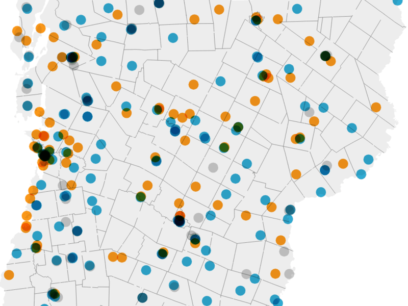 A map with multiple colored dots representing data points distributed across various outlined geographic regions.